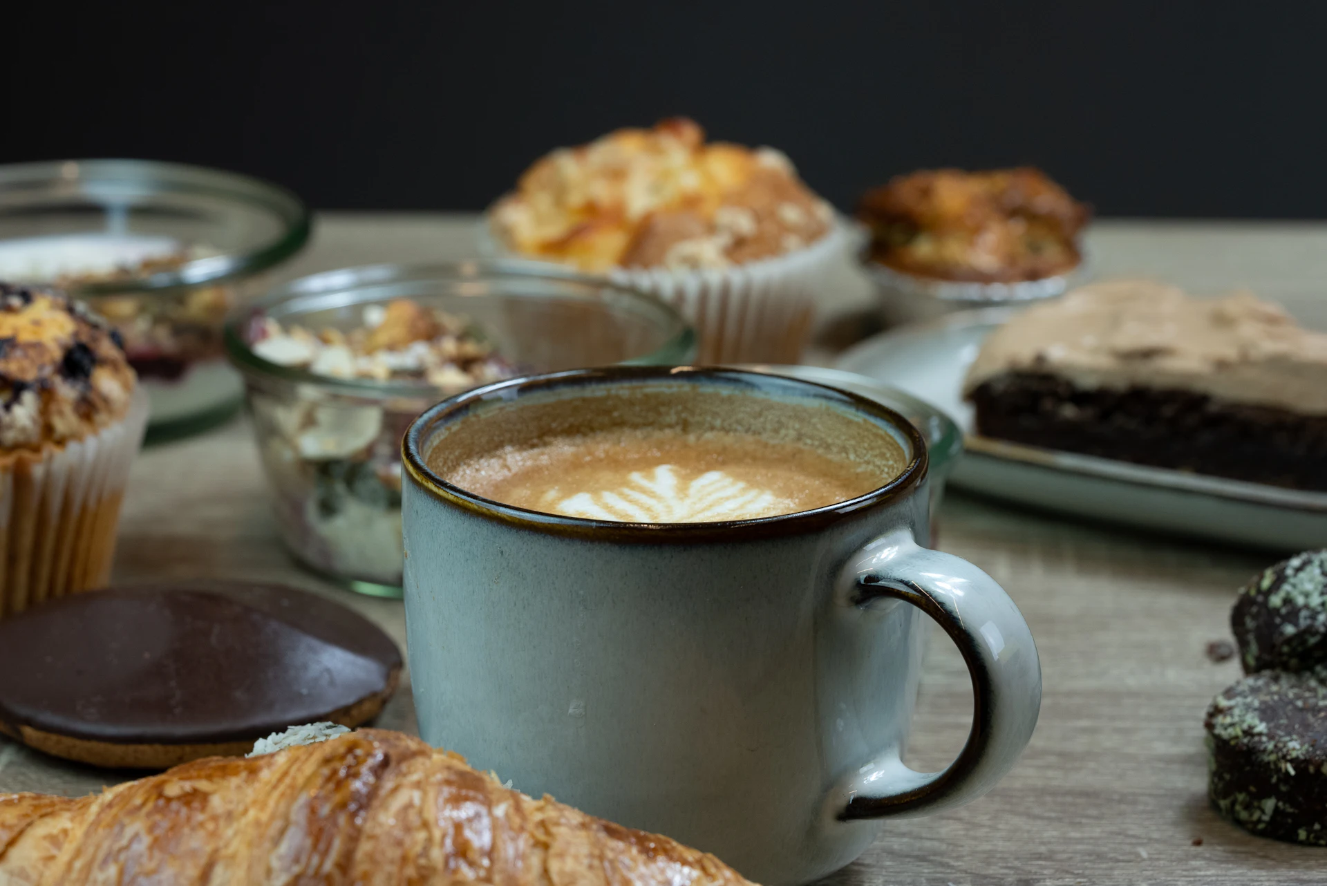 A traditional Swedish fika scene — coffee and pastries on a wooden table